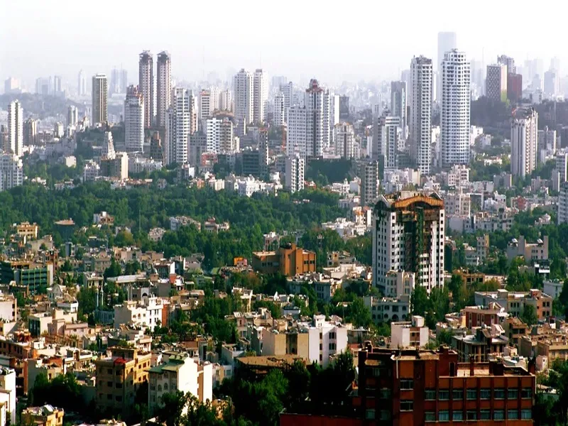 Bangalore skyline with high rise towers rising above low rise housing and tree cover