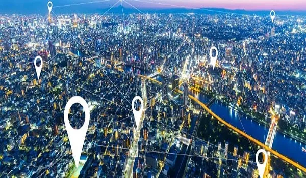 Night time city view overlaid with map markers standing for routes out of Whitefield